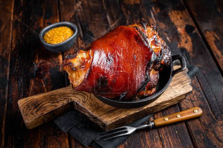 Photo for Bavarian Schweinshaxe Roast pork Hock Ham, knuckle with Sauerkraut. Wooden background. Top view. - Royalty Free Image