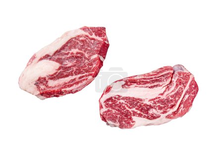 Raw chuck eye roll steaks, premium beef meat on a butcher board. Isolated on white background