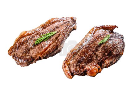 Grilled ramp cap steak on a stone chopping Board. Isolated on white background