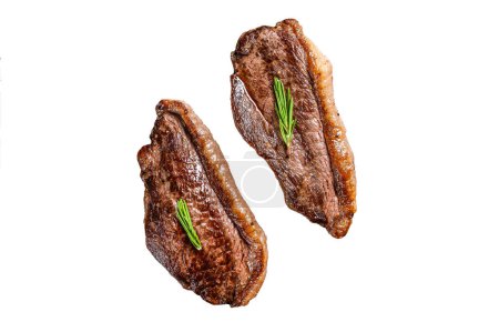 Grilled top sirloin cap or picanha steak on a stone chopping Board. Isolated on white background