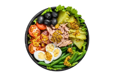 Photo for Gourmet nicoise salad with vegetables, eggs, tuna and anchovies in a pan. Isolated, white background. Top view - Royalty Free Image