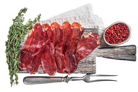 Photo for Pastirma Turkish sliced pastrami, dried beef meat with spices on wooden board. Isolated, white background - Royalty Free Image