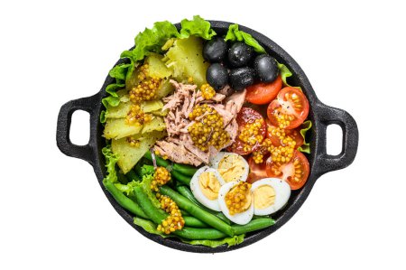 Photo for Gourmet nicoise salad with vegetables, eggs, tuna and anchovies in a pan. Isolated on white background, Top view - Royalty Free Image