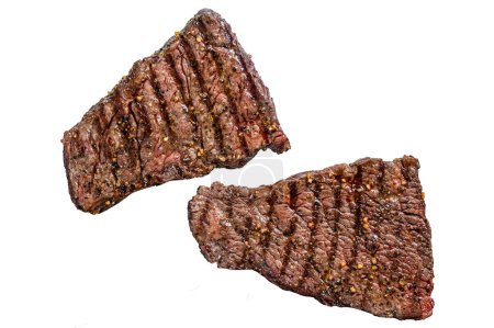 Grilled rump steak with spices. BBQ beef. Isolated on white background. Top view