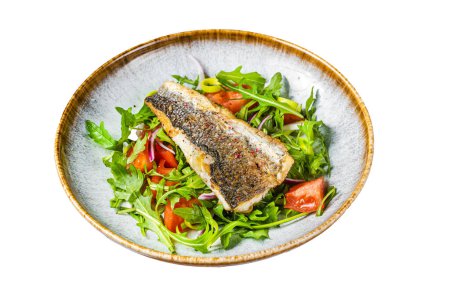 Fried sea bass fillet with vegetable salad, Dicentrarchus fish. Isolated on white background