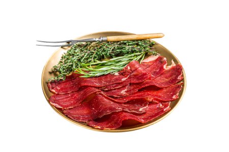 Photo for Basturma, sliced dried beef meat, meat Jerky in steel plate with herbs and spices. Isolated on white background - Royalty Free Image