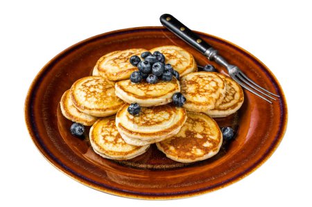 Plate with pancakes with fresh blueberries and syrup . Isolated on white background. Top view