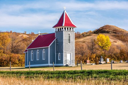 Fall colors surrounding St. Nicholas Anglican Church, also known as Little Church in the Valley, near Craven, SK
