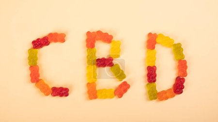 Photo for CBD text from jelly edible candies with thc, recreational drugs. - Royalty Free Image