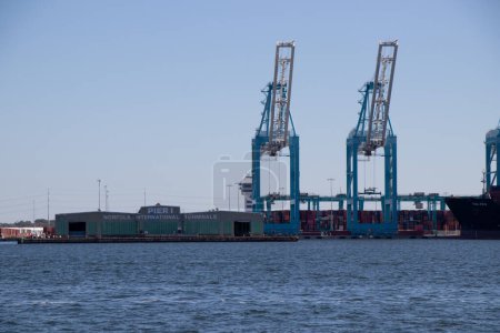 Photo for Norfolk, Virginia, United States - October 6, 2022: Norfolk International Terminals is the Virginia Port Authority's largest terminal. Pictured here are two of the 14 super Post-Panamax class ship-to-shore cranes. - Royalty Free Image