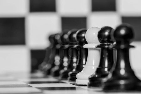 Detail of one of the pawns on a chess board, in black and white