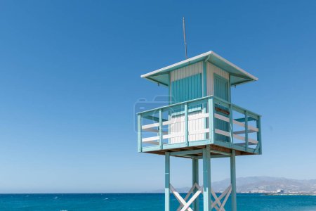 Lifeguard tower hut on a beach of the Mediterranean Sea with blue sky in the background