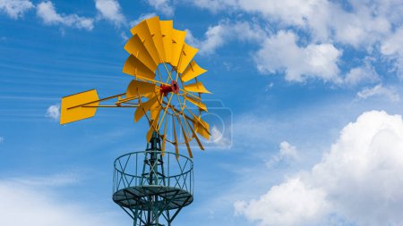 Photo for Windmill for pumping water with the sky in the background - Royalty Free Image