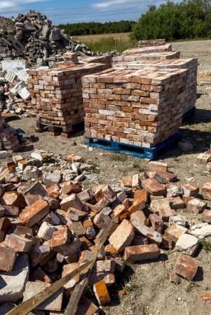 Photo for Recycling of old red bricks. Concrete debris and bricks piled ready to sell. Reusable building materials abstract. - Royalty Free Image