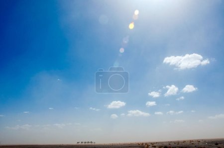 Photo for Sandstorm in the Sahara desert, Morocco, in the background silhouette of dromedaries of the Bedouin population, Berber nomads on the move. Merzouga desert. - Royalty Free Image