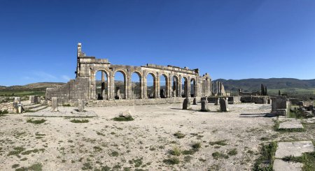 Photo for Morocco, Africa: the remains of the Roman basilica in Volubilis, the most famous Roman archaeological site in Morocco, near Meknes, at the foot of Zerhoun mountain - Royalty Free Image