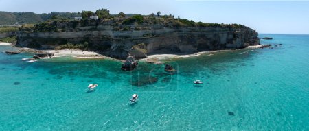 Photo for Aerial view of Petri i Mulinu beach and Skeleton Cave, Tropea, Calabria, Italy. Promontory overlooking the sea, panoramic view. Transparent sea - Royalty Free Image
