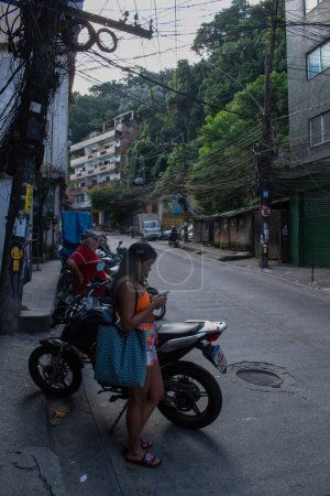 Photo for Brazil, 06-07-2023: daily life in the streets of Rocinha, the famous favela in the southern area of Rio de Janeiro, the largest slum in the country between Gavea, Sao Conrado and Vidigal districts - Royalty Free Image