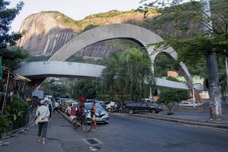 Photo for Brazil, 06-07-2023: Passarela da Rocinha, pedestrian bridge designed by the architect Oscar Niemeyer in the Rocinha district, the most famous favela of Rio de Janeiro and largest slum in the country - Royalty Free Image