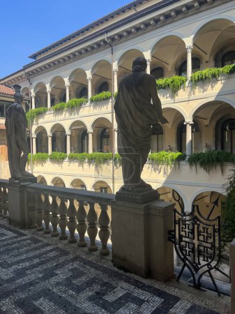 Photo for Pinacoteca Ambrosiana, Milan, Italy, 07-09-2023: the Courtyard of the Great Spirits, designed by prefect Giovanni Galbiati in 1932 and named after the verses of Inferno (canto IV) where Dante sees the great men of poetry, science, culture in Limbo - Royalty Free Image