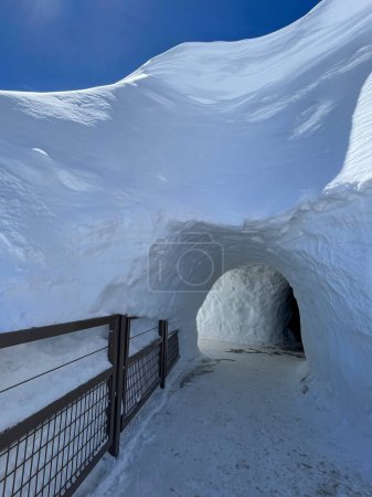 Haute-Savoie, France, 04-25-2024: ice tunnel on the top of LAiguille du Midi (Needle at midday), the highest spire (3.842 m) of the Aiguilles de Chamonix in the northern part of the Mont Blanc massif