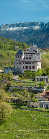 Aerial view of the Chateau de Menthon is a medieval castle located in the commune of Menthon-Saint-Bernard. From its raised position, the castle stands out over Lake Annecy and the mountains. France