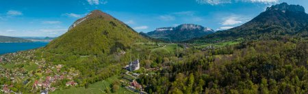 Aerial view of the Chateau de Menthon is a medieval castle located in the commune of Menthon-Saint-Bernard. From its raised position, the castle stands out over Lake Annecy and the mountains. France