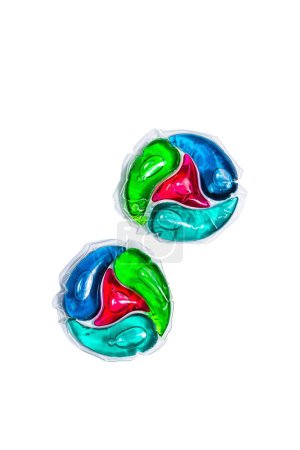 Capsules with detergent for washing machine isolated on white background. Laundry pods, liquid colored gel. Economical and environment friendly for clothes washing, flat lay