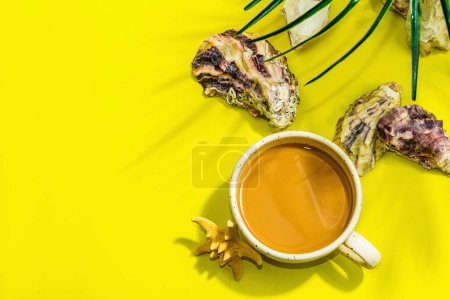 Photo for A cup of coffee in a marine style. Starfish, oysters, palm leaves. Hard light, dark shadow, bright yellow background, flat lay, top view - Royalty Free Image