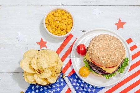 Photo for Homemade burgers. An American classic, traditional food for picnic, party or celebration Independence Day. Hard light, dark shadow, flat lay, white wooden background, top view - Royalty Free Image