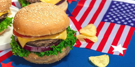 Photo for Homemade burgers. An American classic, traditional food for picnic, party or celebration Independence Day. Hard light, dark shadow, flat lay, blue background, banner format - Royalty Free Image