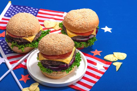 Photo for Homemade burgers. An American classic, traditional food for picnic, party or celebration Independence Day. Hard light, dark shadow, flat lay, blue background, copy space - Royalty Free Image