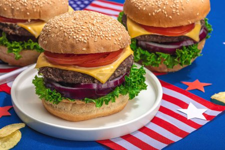 Photo for Homemade burgers. An American classic, traditional food for picnic, party or celebration Independence Day. Hard light, dark shadow, flat lay, blue background, close up - Royalty Free Image