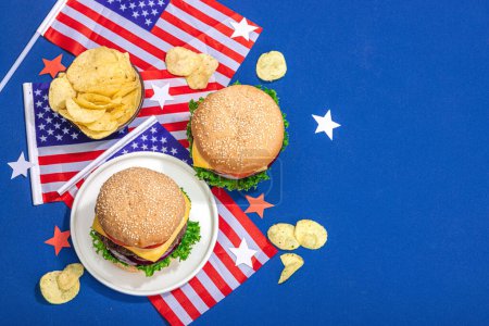 Photo for Homemade burgers. An American classic, traditional food for picnic, party or celebration Independence Day. Hard light, dark shadow, flat lay, blue background, top view - Royalty Free Image