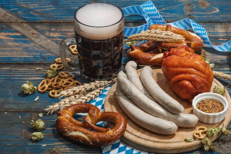 Photo for Traditional Oktoberfest set. Pretzels, beer, weisswurst and eisbein with mustard. German festival food concept. Trendy hard light, dark shadow, wooden background, copy space - Royalty Free Image