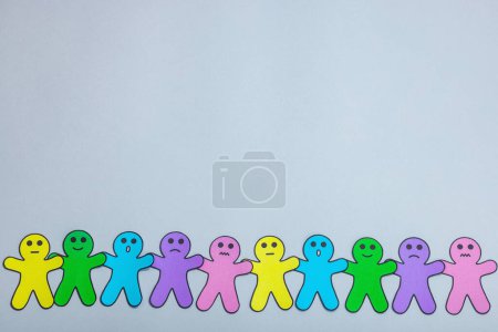 Photo for World mental health day. Paper men figures with different emotions. Feedback rating, customer review, experience, satisfaction survey or assessment concept. Neutral gray background, flat lay, top view - Royalty Free Image