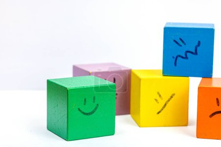 Photo for World mental health day. wooden cubes with different emotions. Feedback rating, customer review, experience, satisfaction survey or assessment concept, flat lay, selective focus - Royalty Free Image