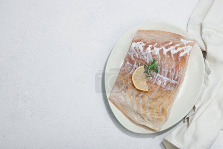 Photo for Raw pollock (Pollachius virens) fillet. Fresh fish for healthy food lifestyle. Lemon, rosemary, sea salt, chili, black peppercorn. Light stone concrete background, flat lay, top view - Royalty Free Image