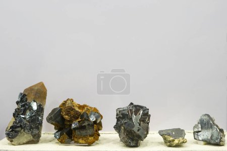 Photo for Collection of various minerals on gray background : cassiterite stones - Royalty Free Image