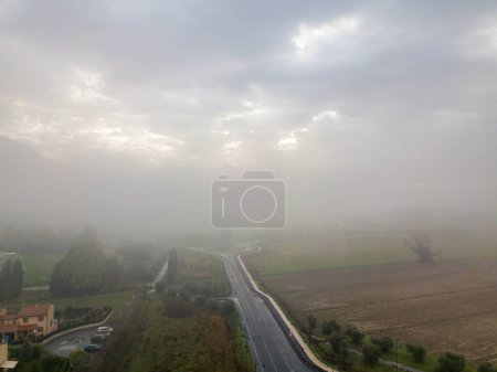Photo for Aerial view street in the fog, Tuscany. - Royalty Free Image