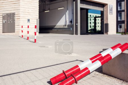 Photo for Bollards Road Barriers Gate to Private Entrance or Commercial Entry of Building. Strip Red White Borders to Forbidden Zone - Royalty Free Image