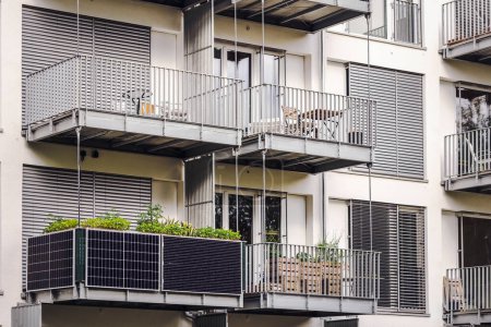 Solar Panel Battery on Balcony of Modern Apartment Building or Residential House. Solar Green Energy, Eco Technology concept.