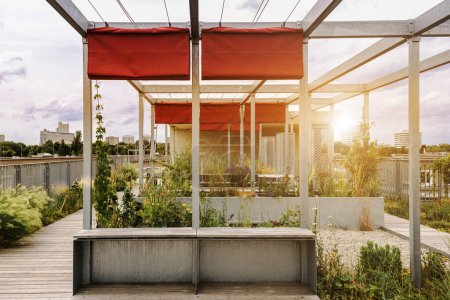 Pergola Awning in Garden Roof of Apartment Building. Modern Aluminum Fabric Rolling Pergola on Roof Terrace of Residential Neighborhood House.