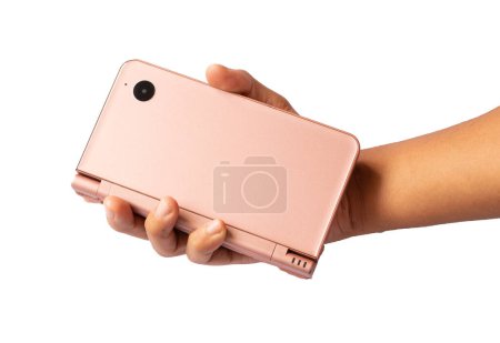 Foto de Persona sosteniendo una consola de juegos rosa - Imagen libre de derechos