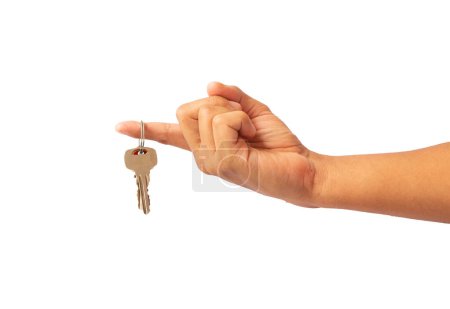 Foto de Persona sosteniendo algunas llaves con el dedo sobre fondo blanco - Imagen libre de derechos