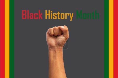 Photo for Fist up representing black history month with the flag on the sides - Royalty Free Image