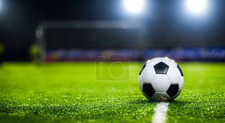 Photo for Ball in the middle of a beautiful soccer field with amazing green grass - Royalty Free Image