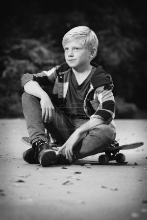 Photo for Young boy posing outdoor in skate park for monochrome book photos - Royalty Free Image