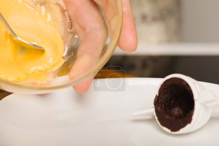 Photo for Filling of traditional christmas sweets bee hives with yolk creme - Royalty Free Image