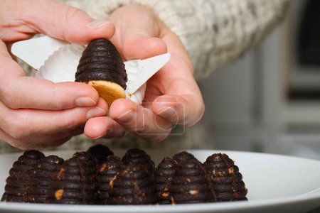 Photo for Extraction of traditional christmas sweets bee hives from plastic form - Royalty Free Image